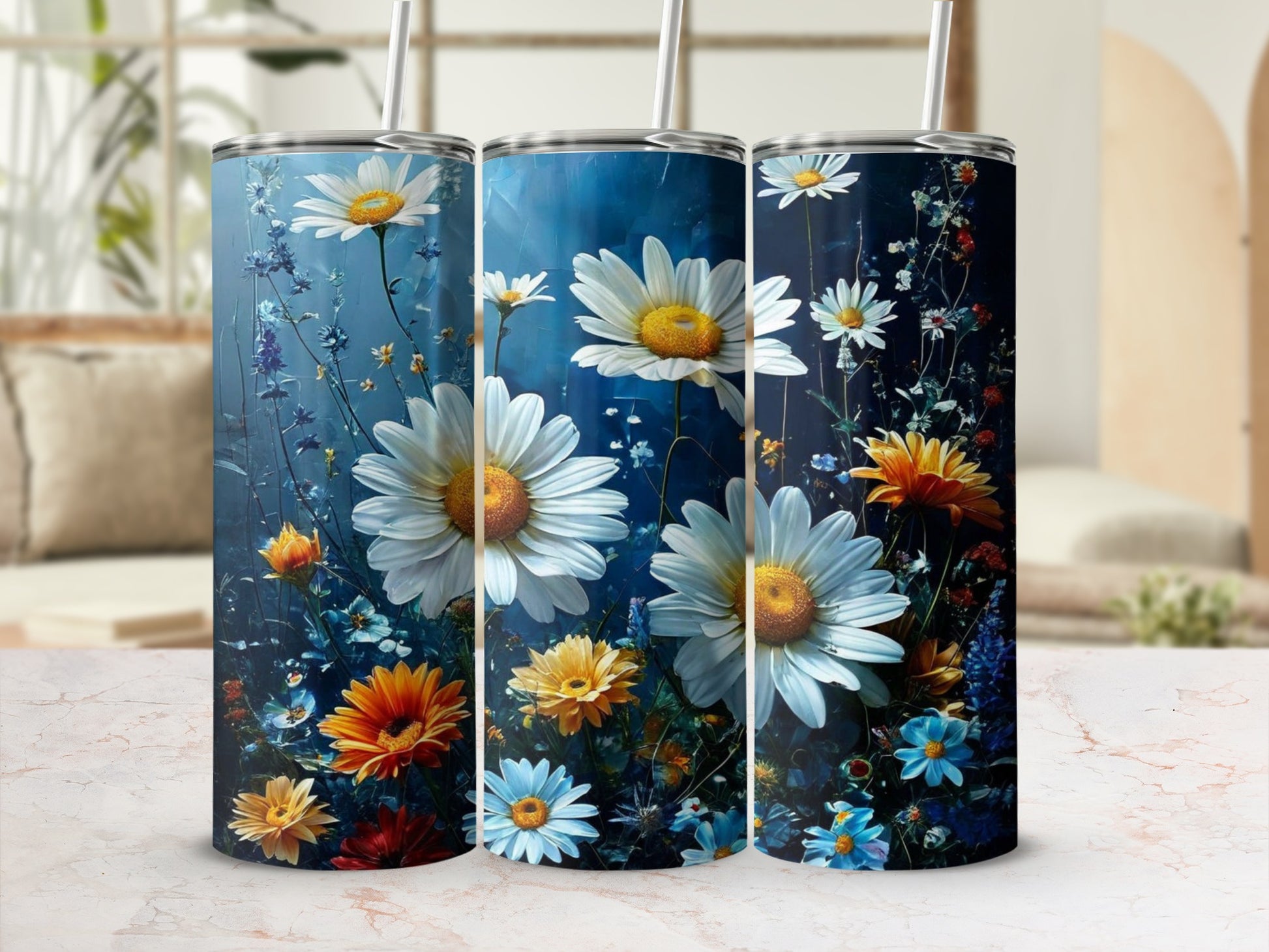 Three tumblers featuring a dark blue background with white and yellow daisies.