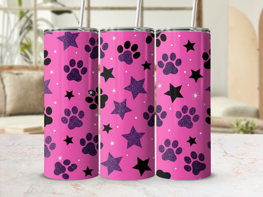 Pink tumbler with black paw prints and glitter stars pattern.