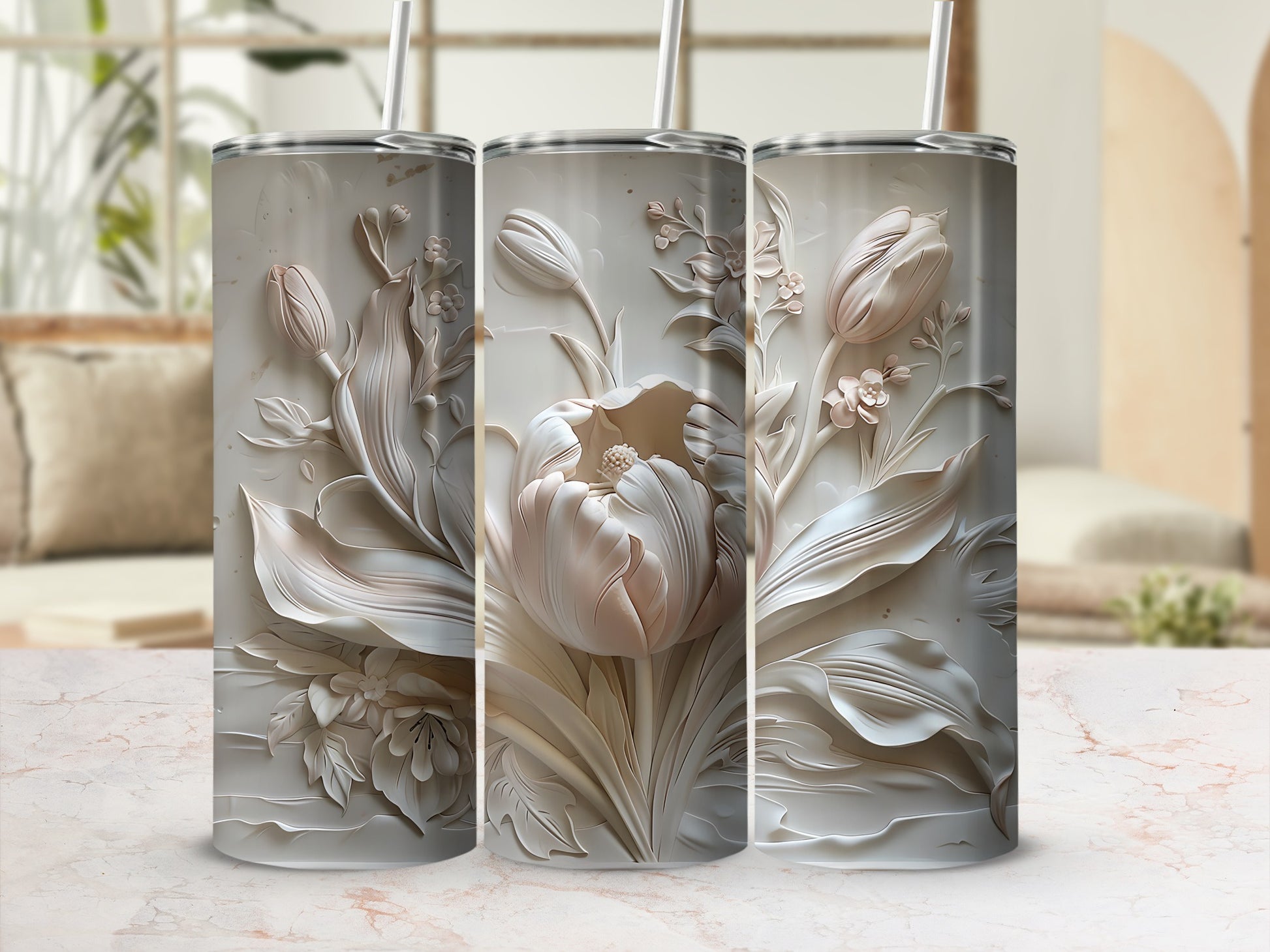 Three textured tumblers with embossed floral designs, featuring tulips and leaves.