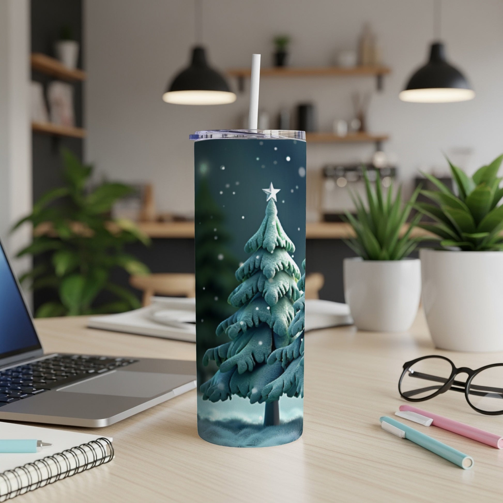 Snowy Christmas tree design on a white tumbler with a straw.