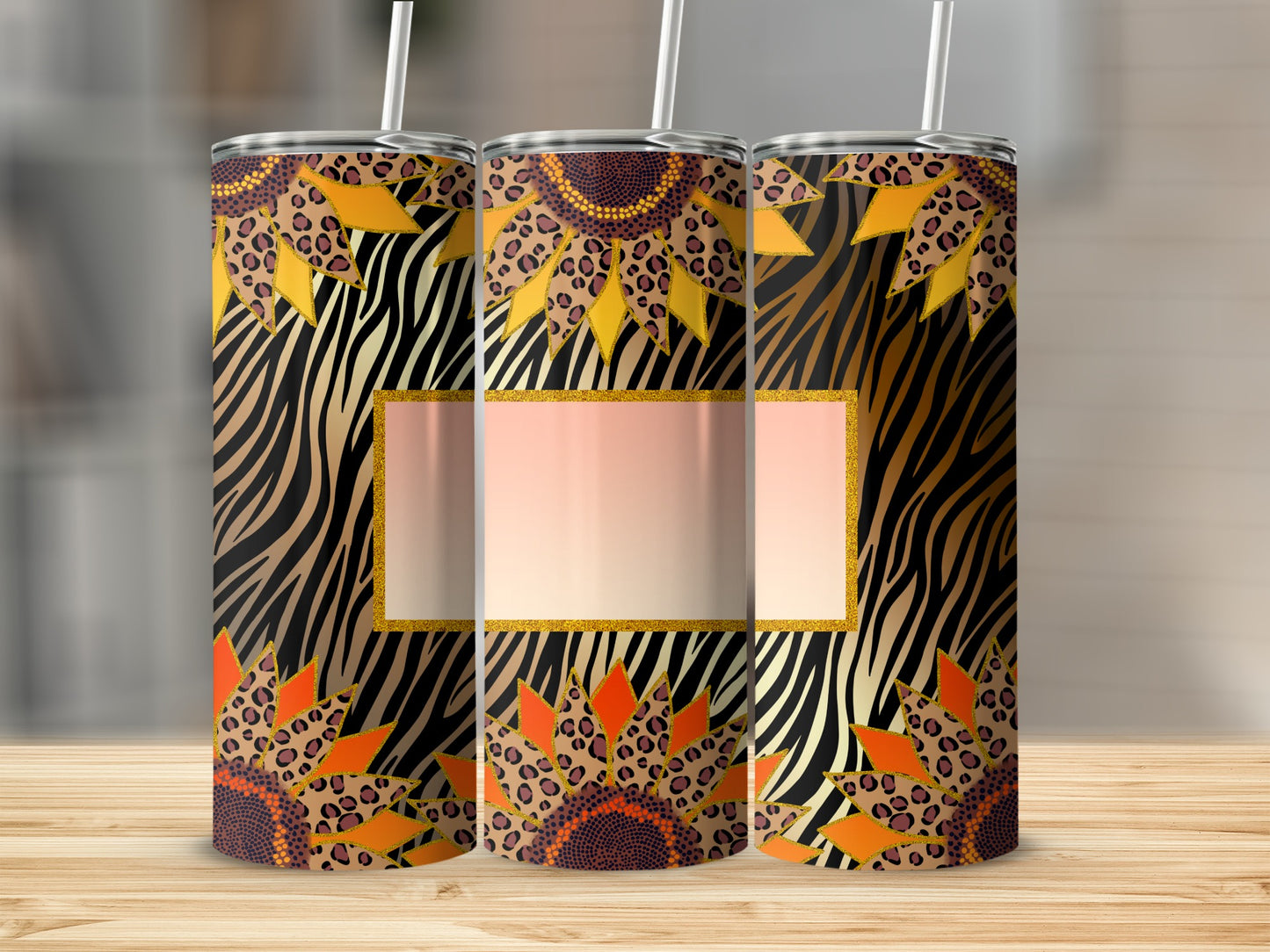Sunflower and animal print pattern on three insulated tumblers with straws.