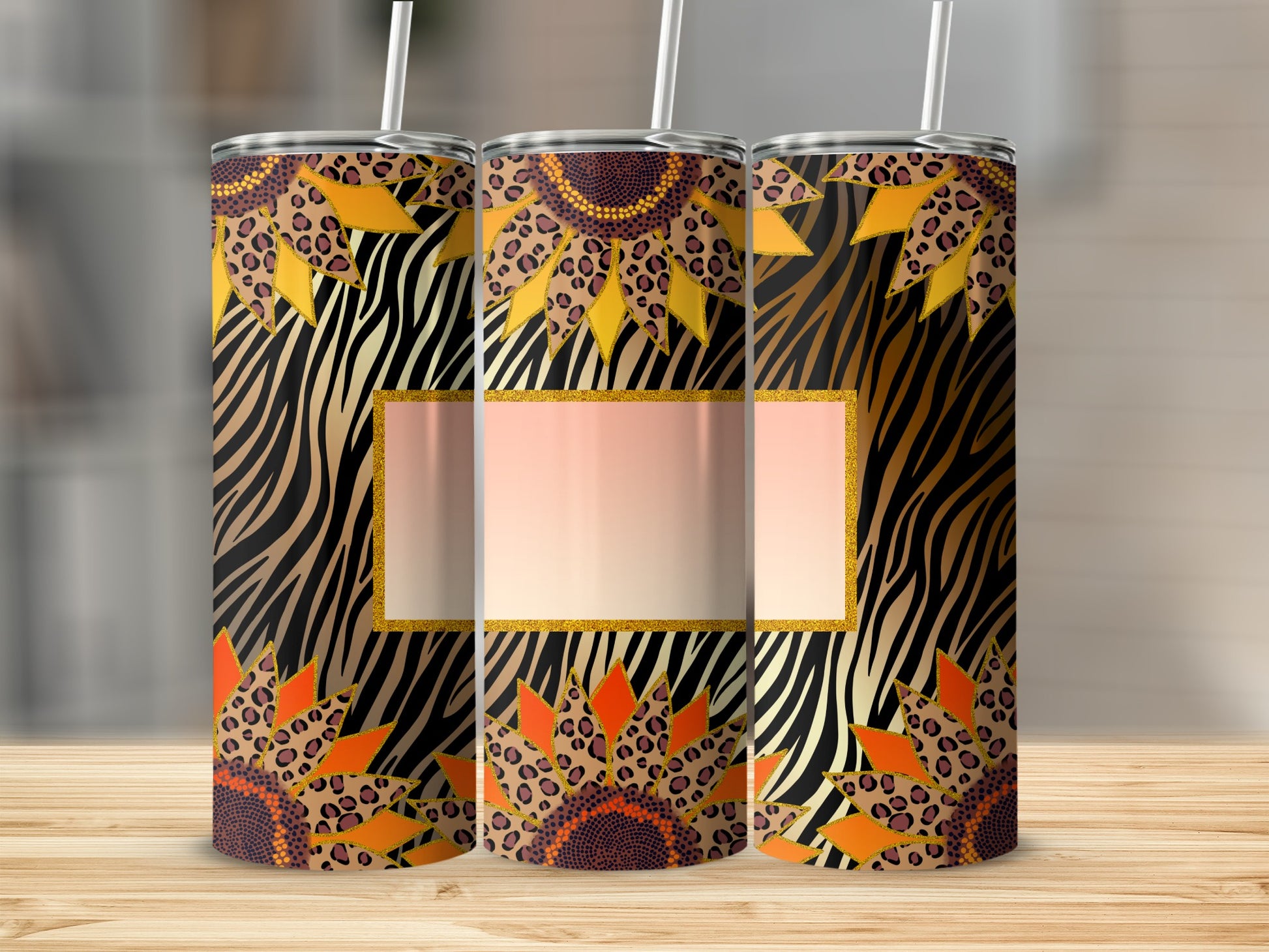 Sunflower and animal print pattern on three insulated tumblers with straws.
