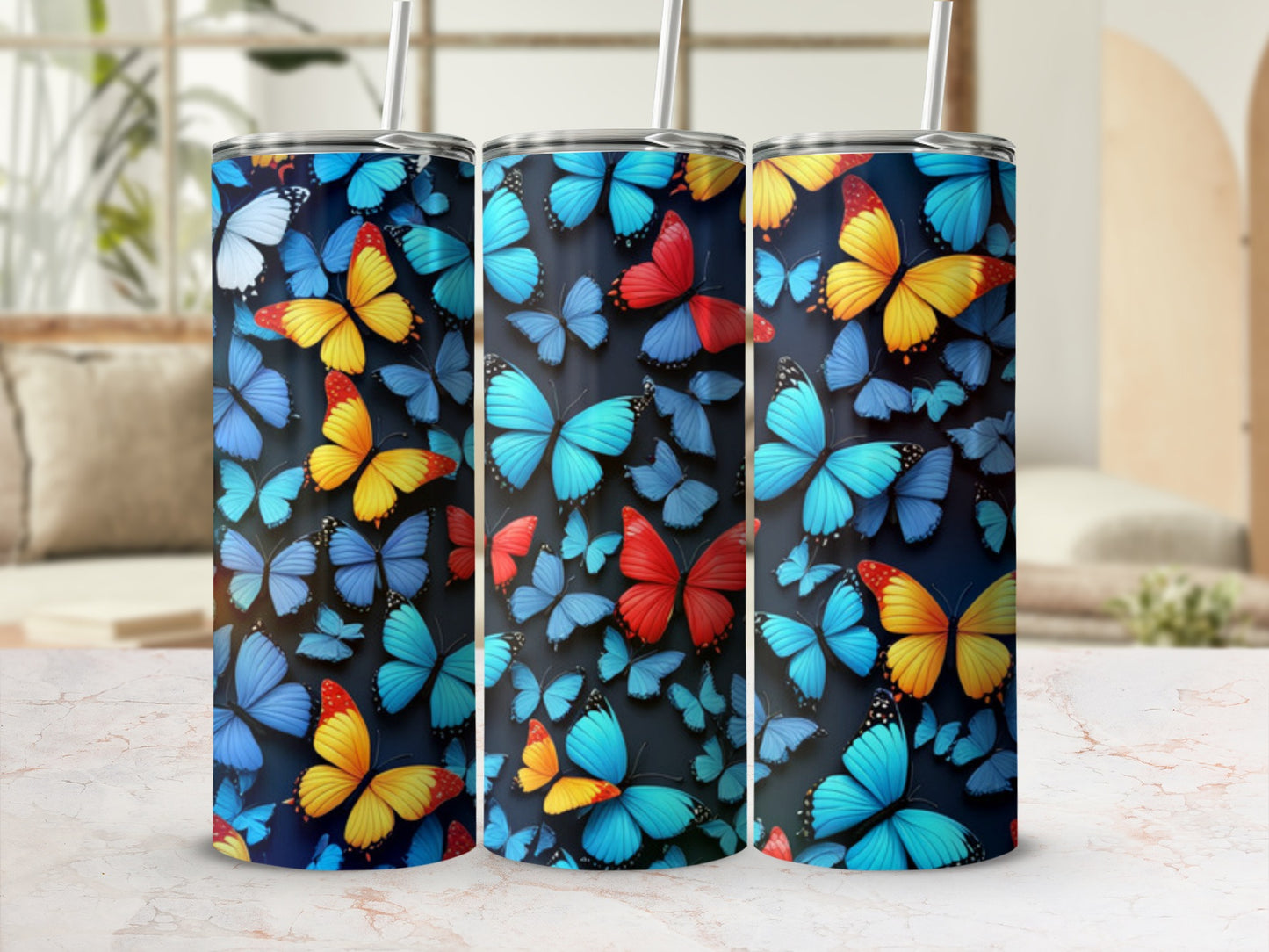 Tumbler with a vibrant pattern of blue, orange, and yellow butterflies.