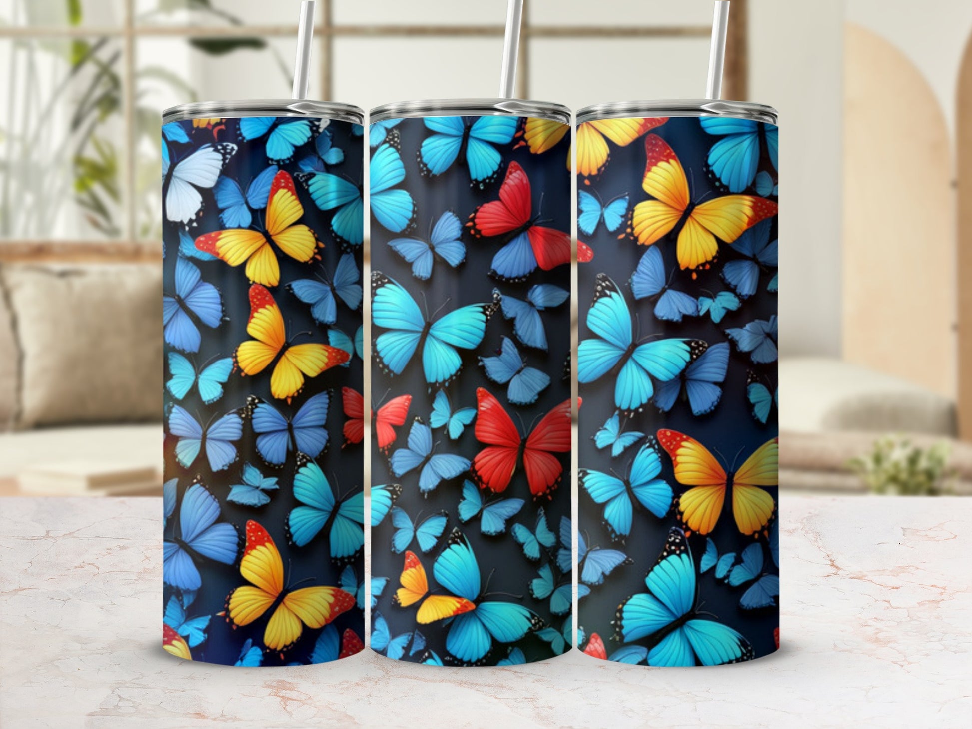 Tumbler with a vibrant pattern of blue, orange, and yellow butterflies.