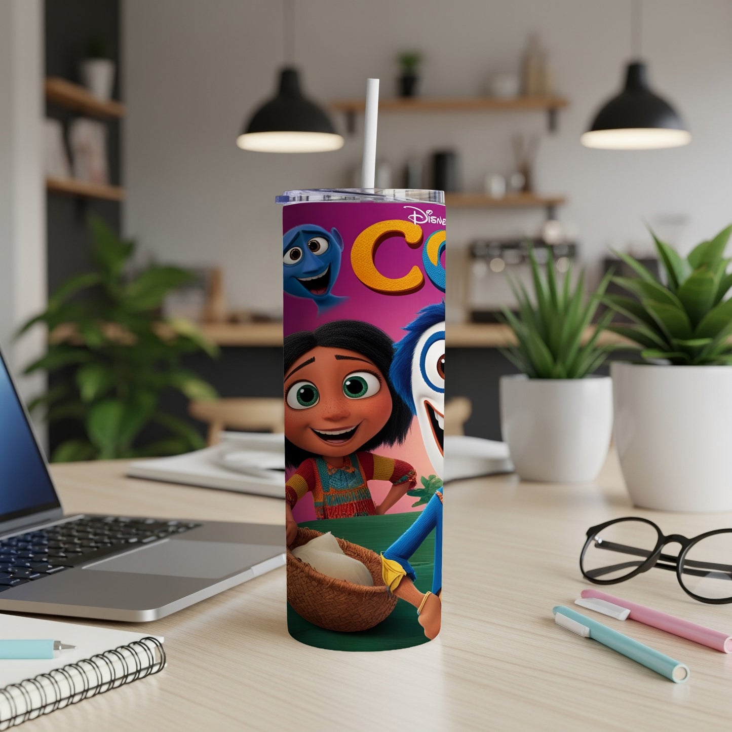 Disney characters Joy and Sadness on a tumbler with a straw.