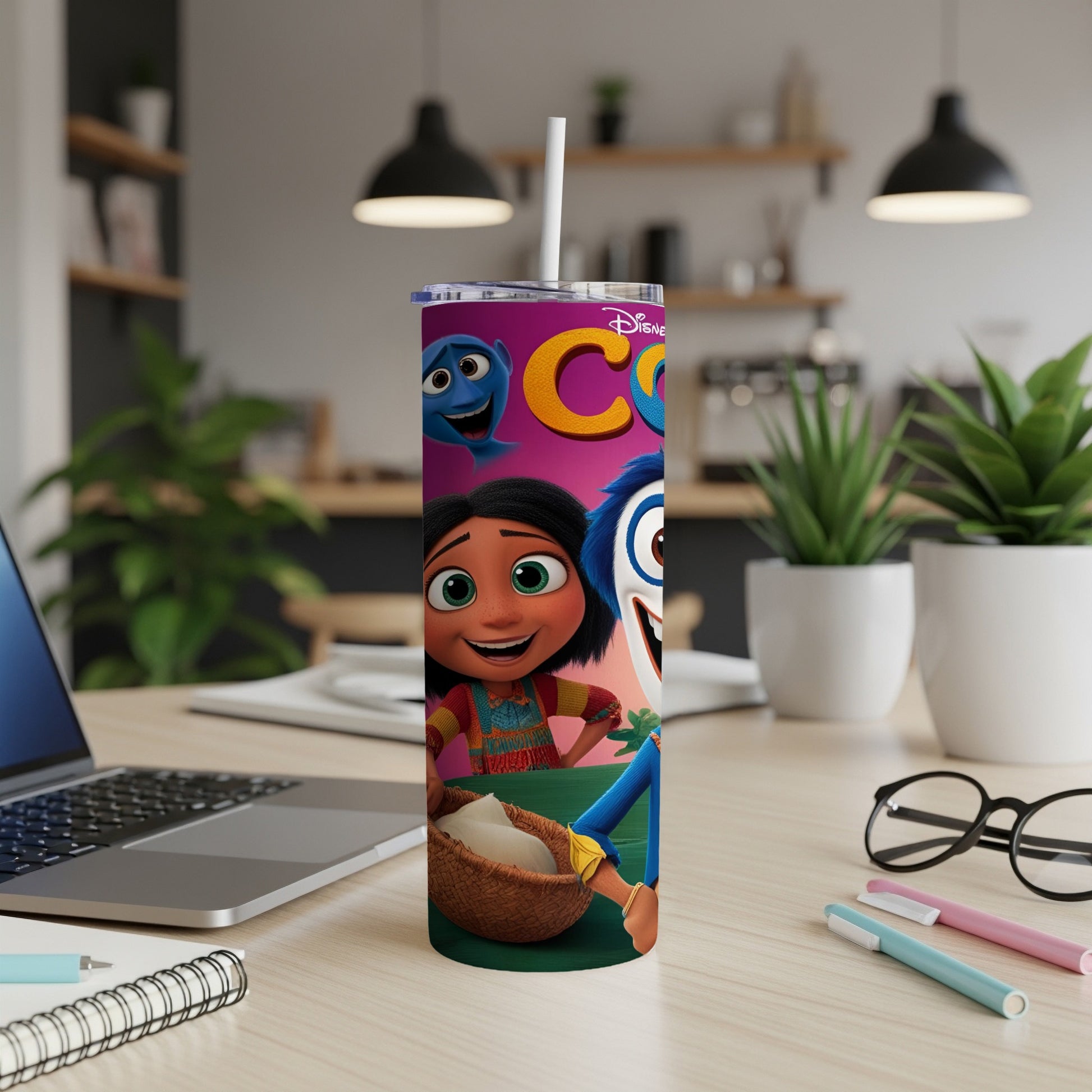 Disney characters Joy and Sadness on a tumbler with a straw.