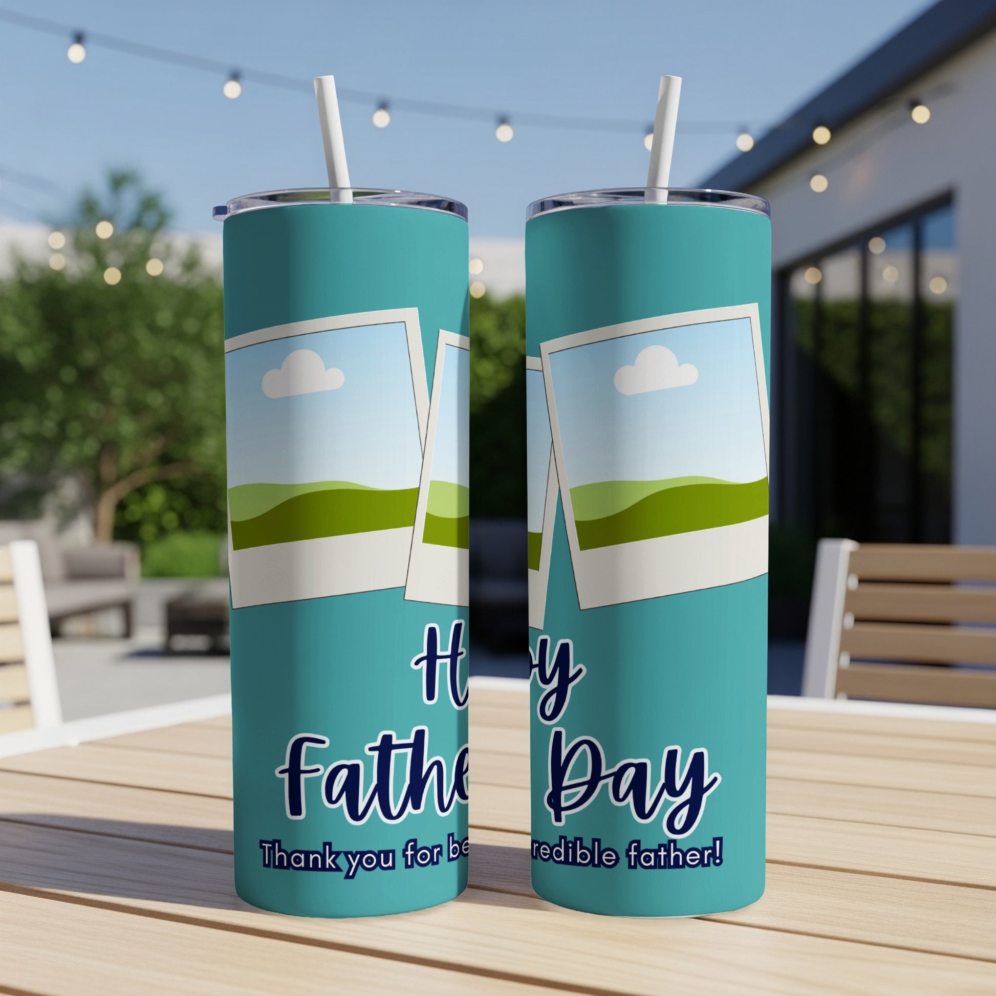 Two teal tumblers with "Happy Father Day" text and framed landscape photos.
