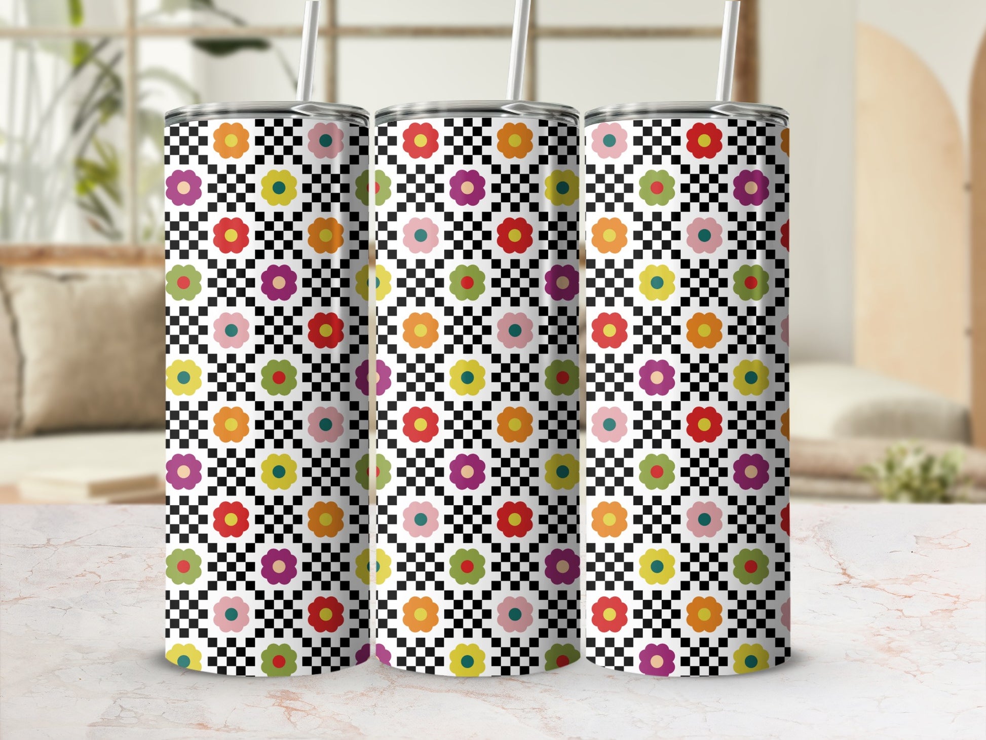 Three tumblers with checkered pattern and colorful floral design.