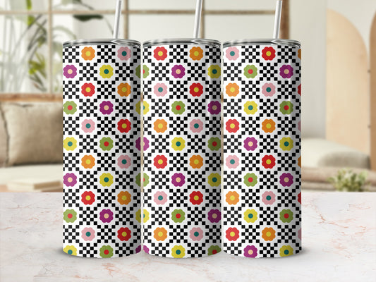 Three tumblers with checkered pattern and colorful floral design.