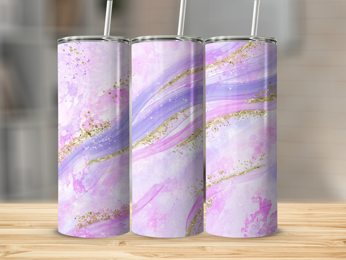 Three tumblers with a marbled pink and purple design and gold glitter accents.