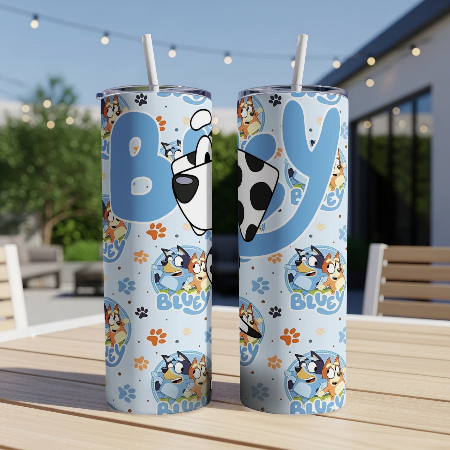Bluey characters and paw prints on a light blue tumbler.