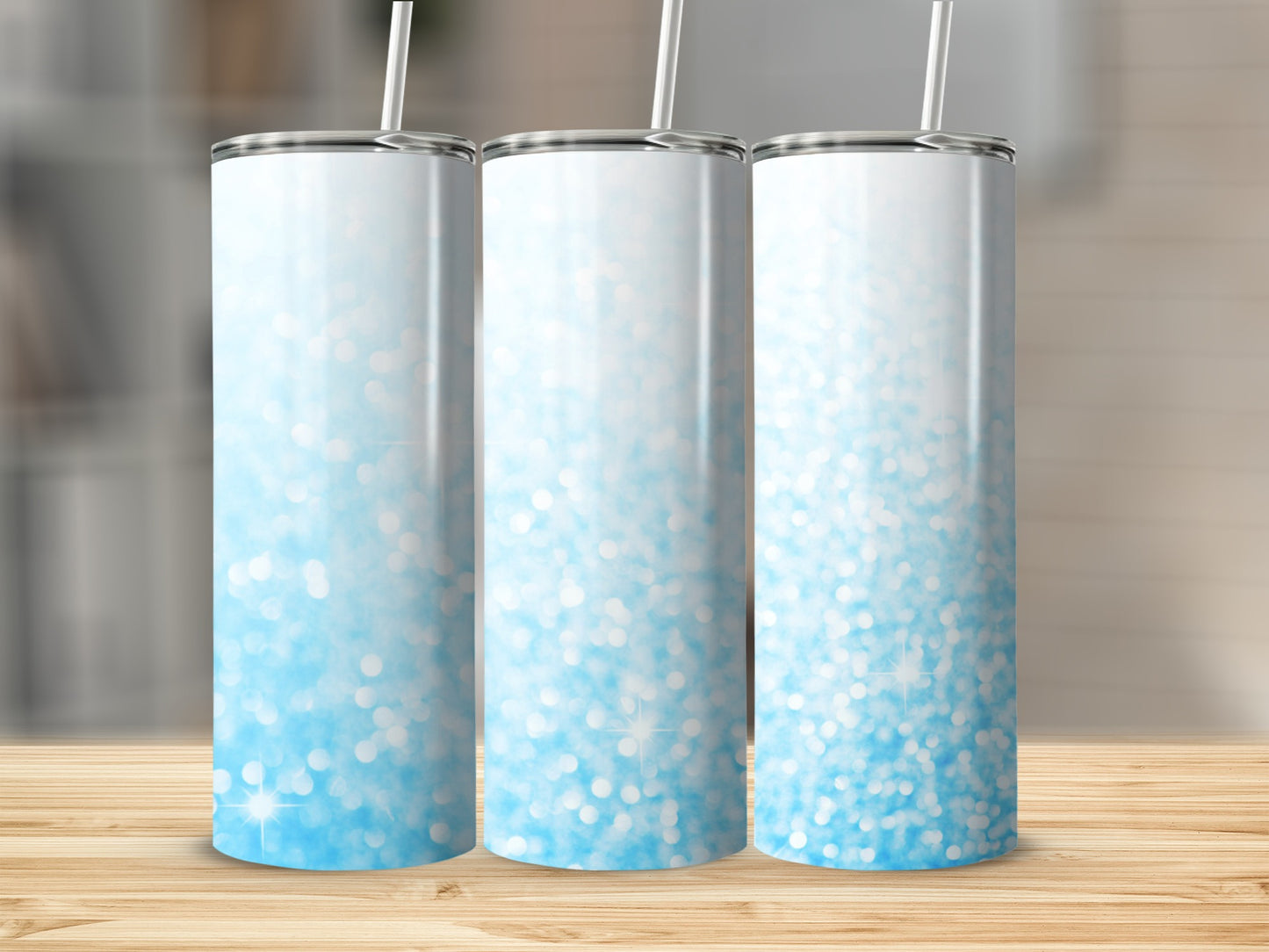 Three tall, skinny tumblers with a blue glitter gradient design.