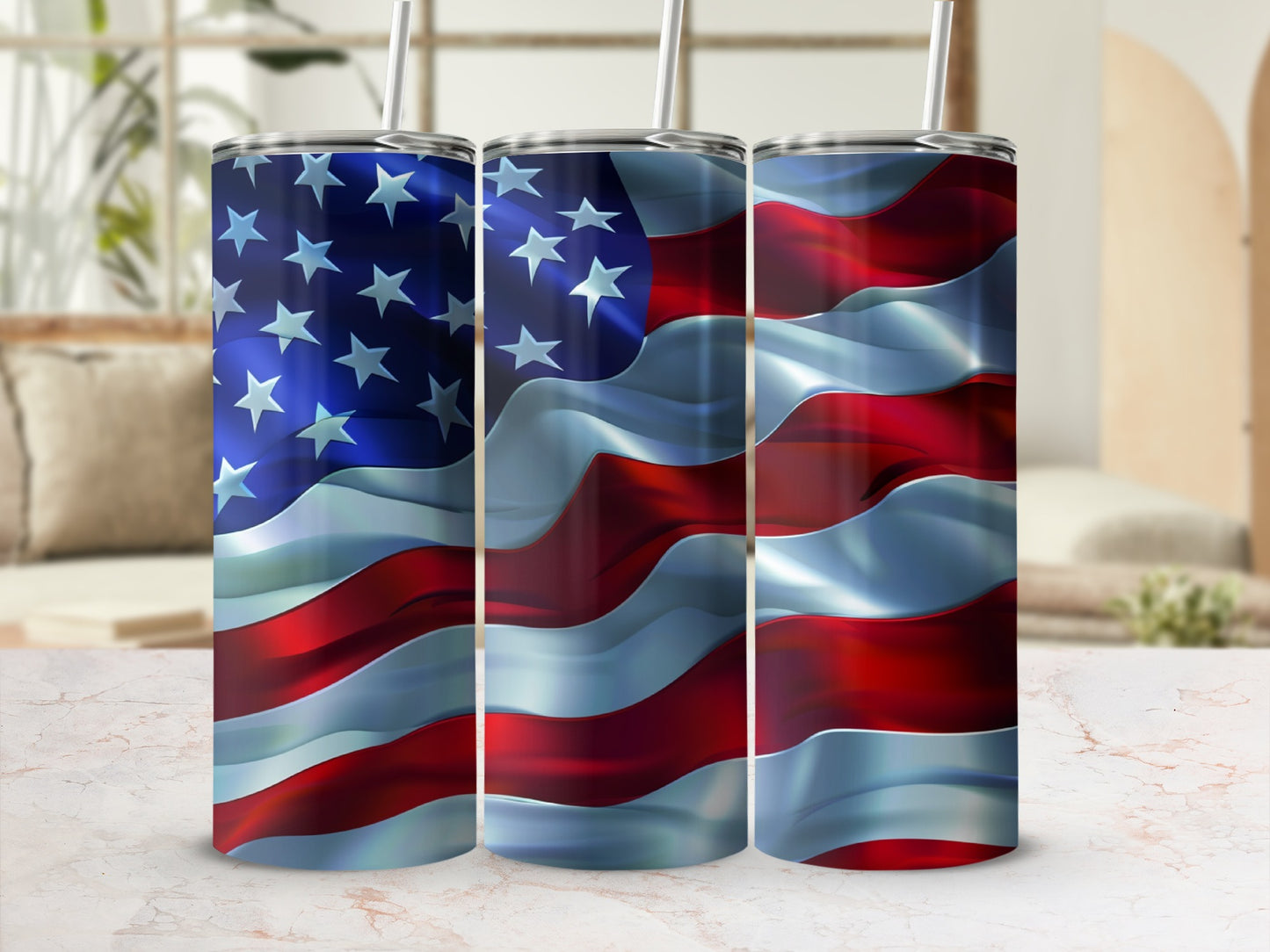 Three tumblers with the American flag design, each with a straw.