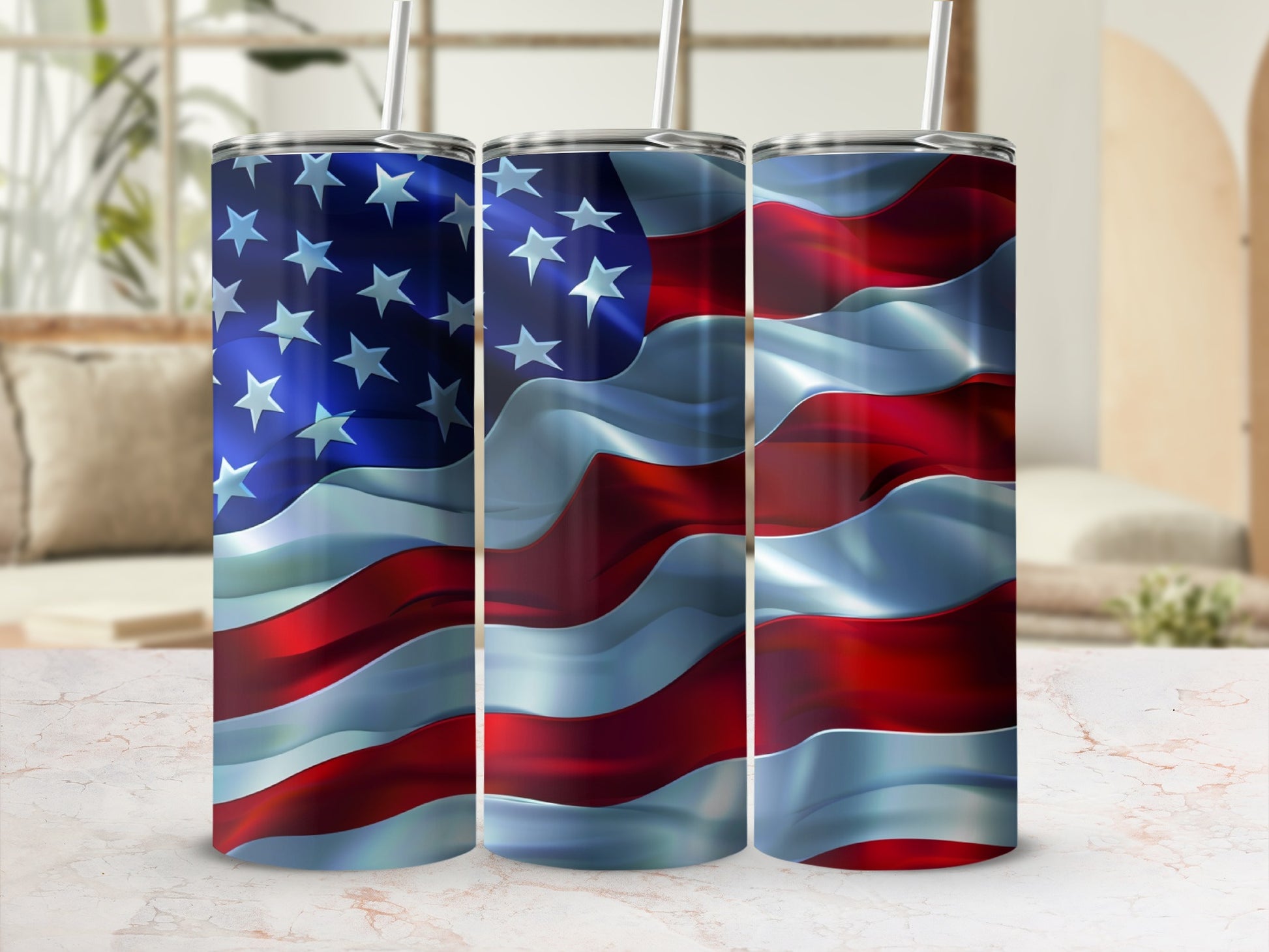 Three tumblers with the American flag design, each with a straw.