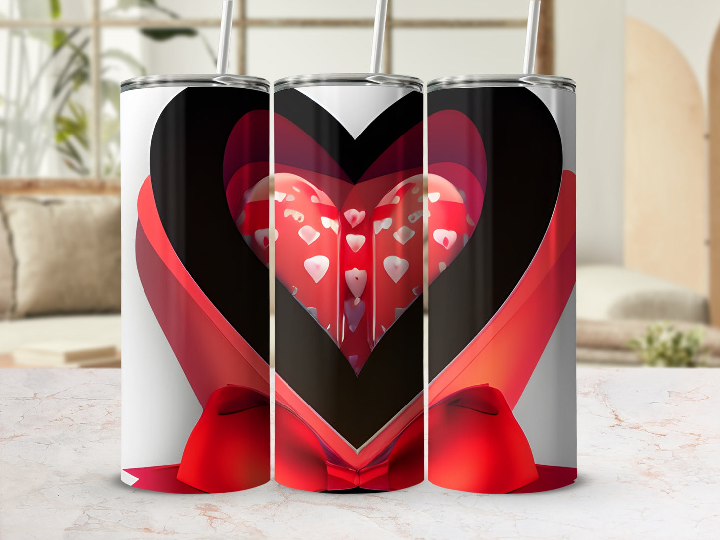 Three tumblers with a red ribbon and heart pattern.