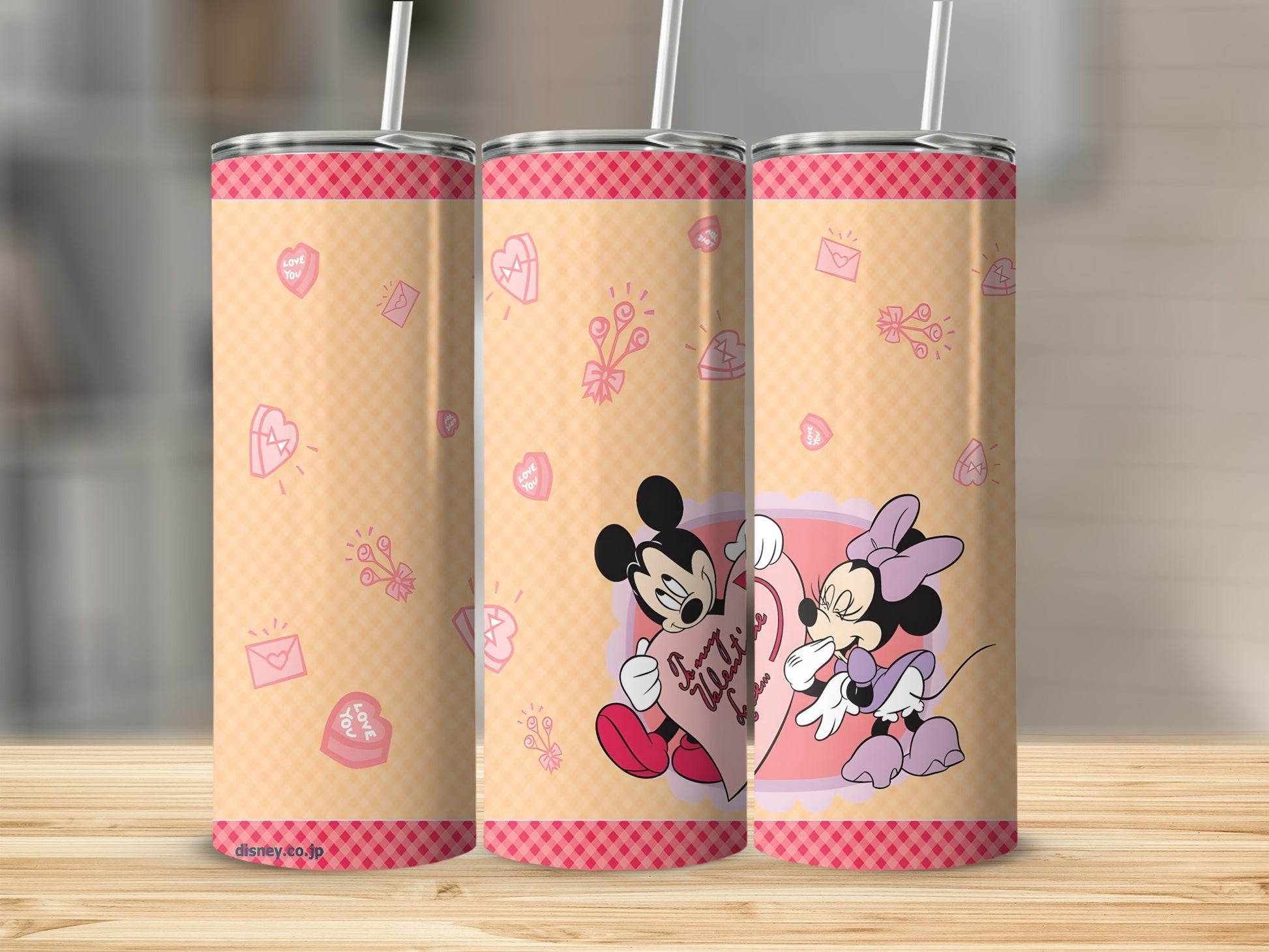 Minnie and Mickey Mouse with "I Love You" text on a pink and orange patterned tumbler.