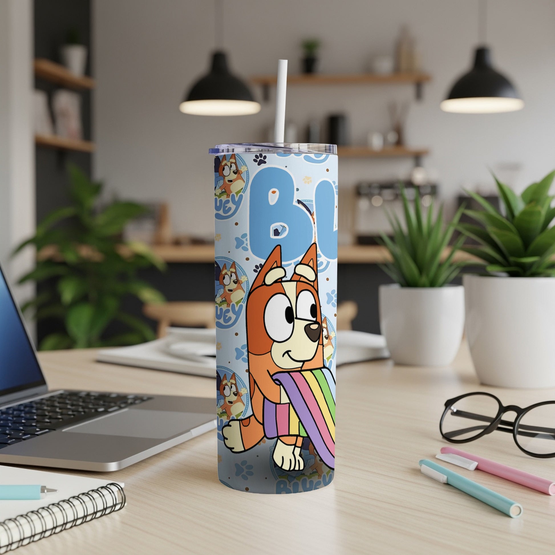 Bluey character on a light blue tumbler with a rainbow design.