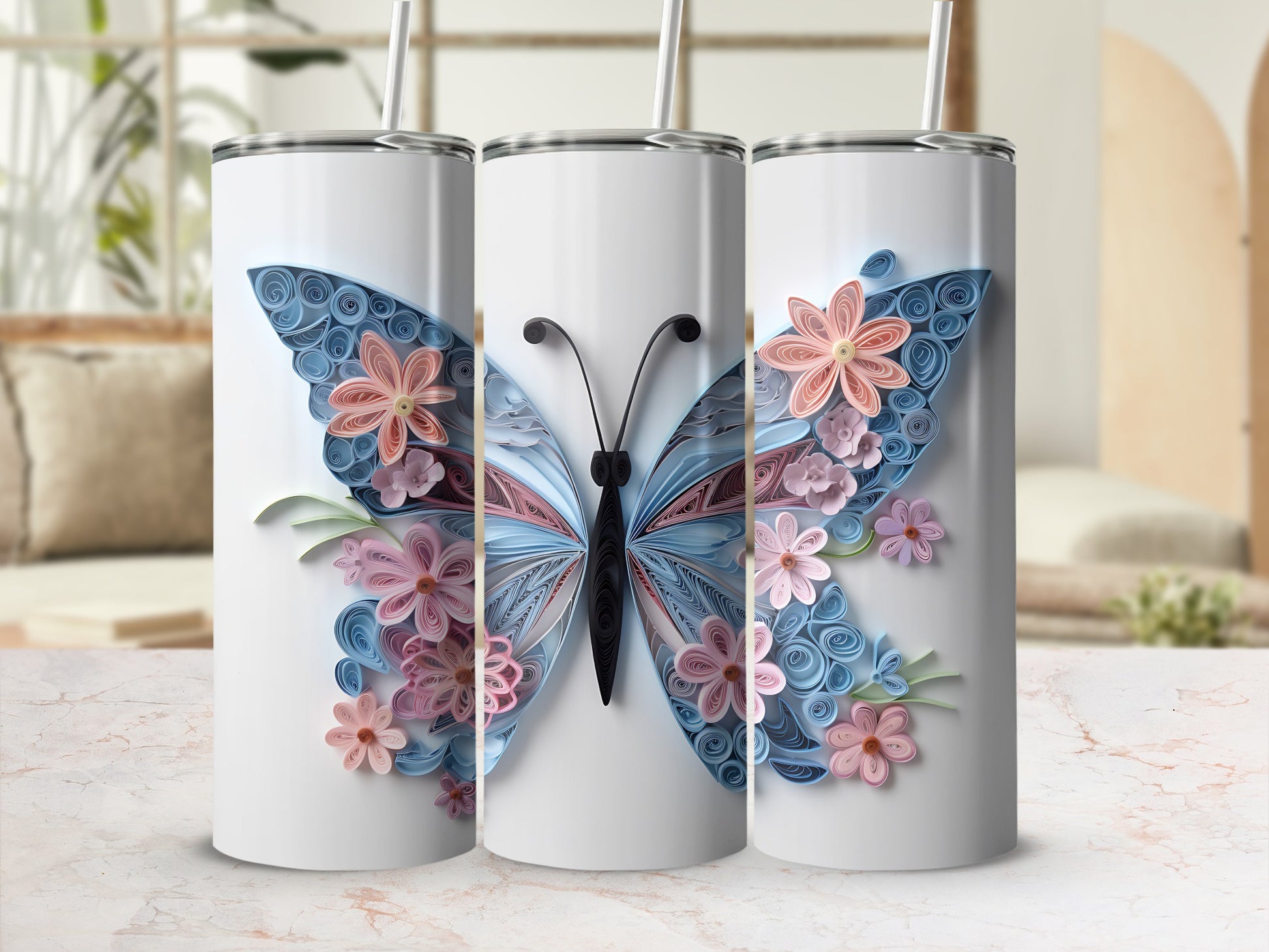 Three white tumblers decorated with a large blue and pink paper quilled butterfly.