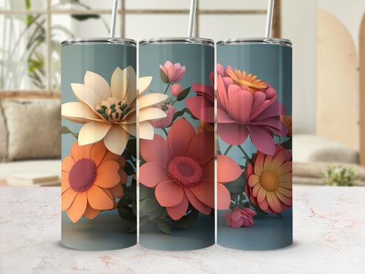Three tumblers with colorful floral designs and straws.