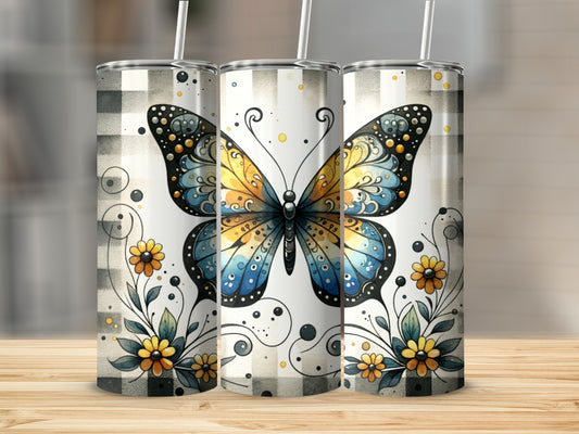 Three tumblers with a butterfly and floral design on a wooden surface.