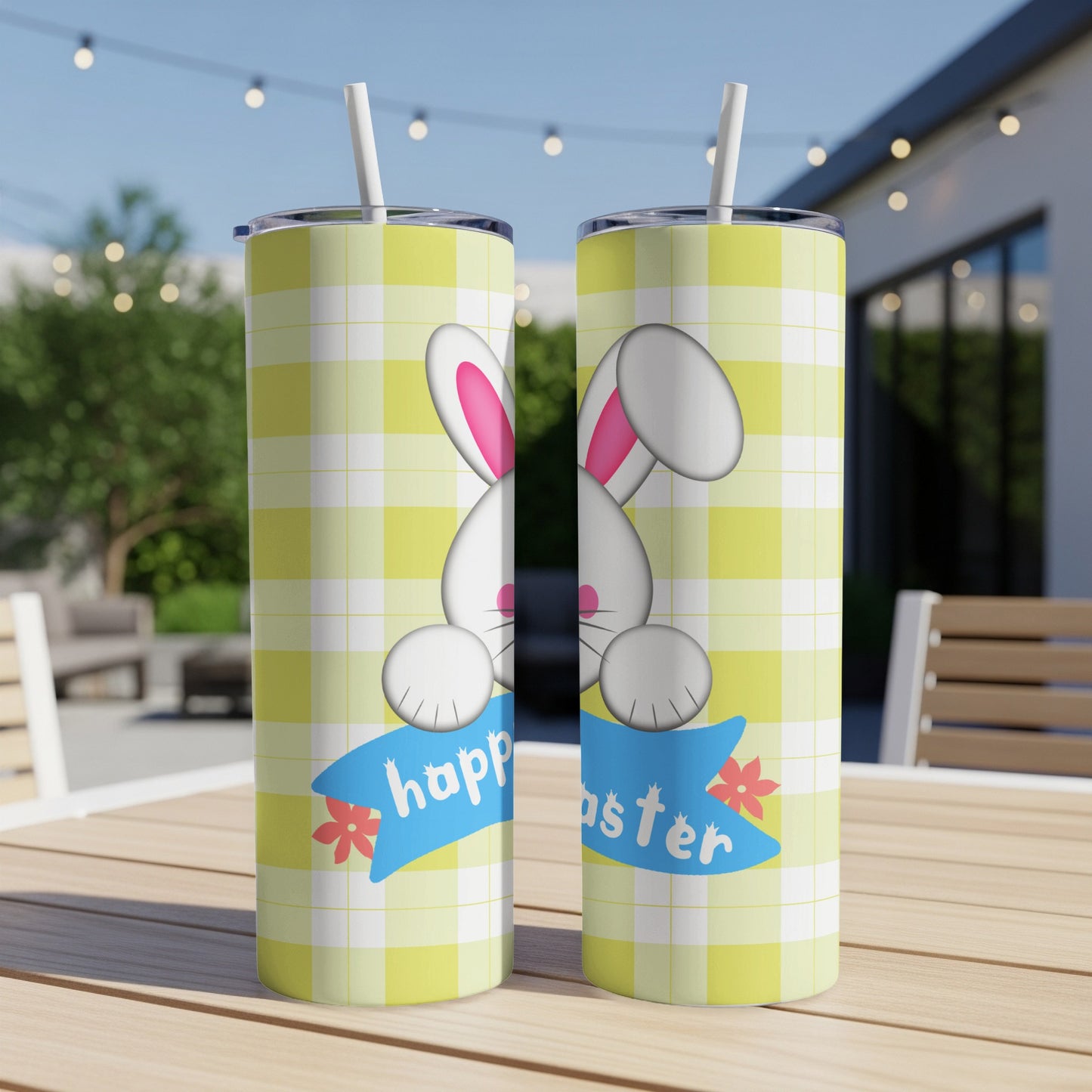 Two tumblers with a yellow checkered pattern and bunny ears saying "happy easter".