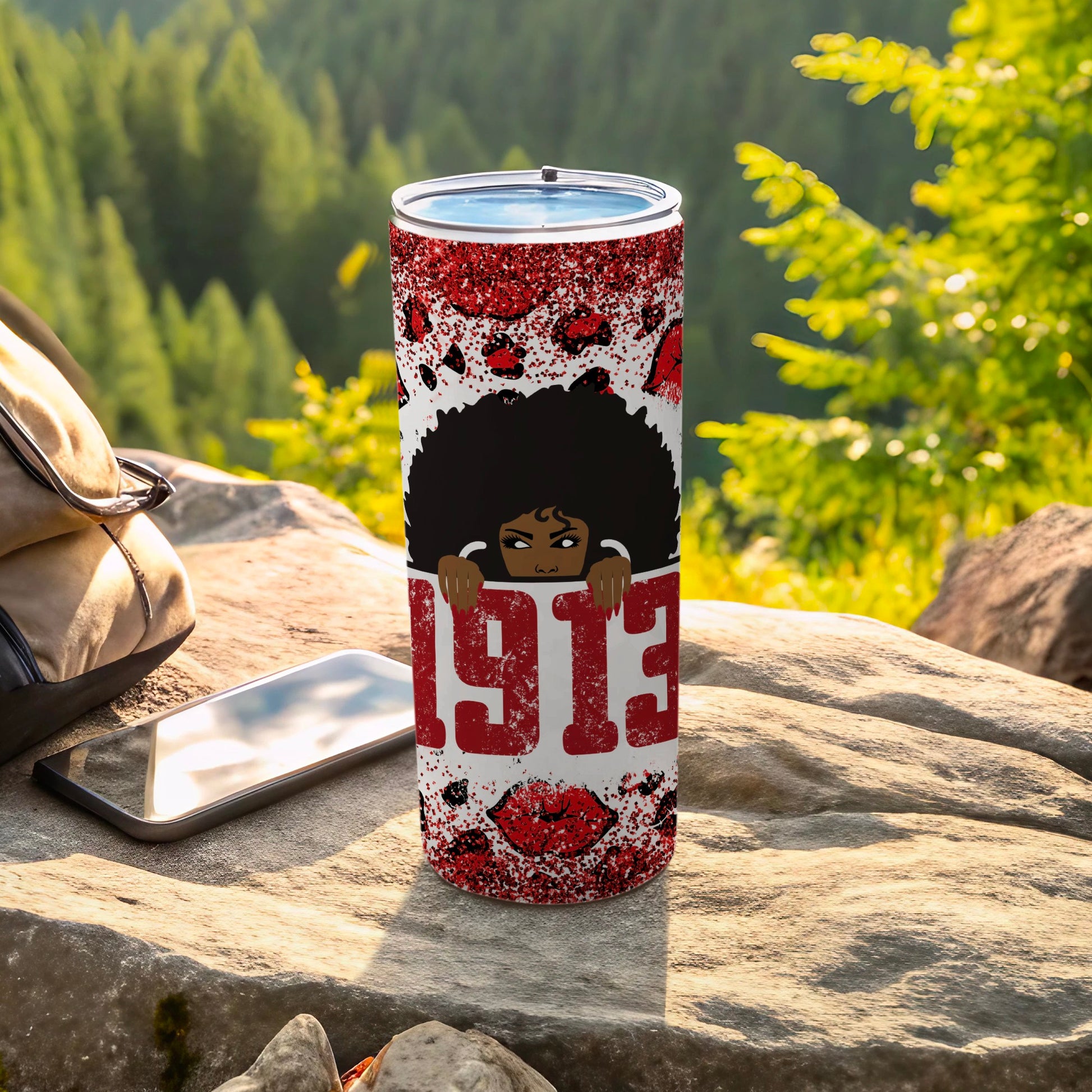 Tumbler with "1913" and woman's silhouette design.