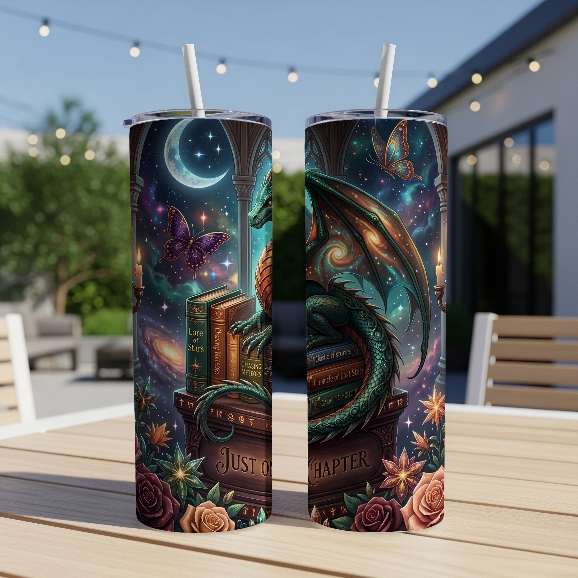 Two tumblers with a dragon, moon, stars, butterflies, books, and roses.