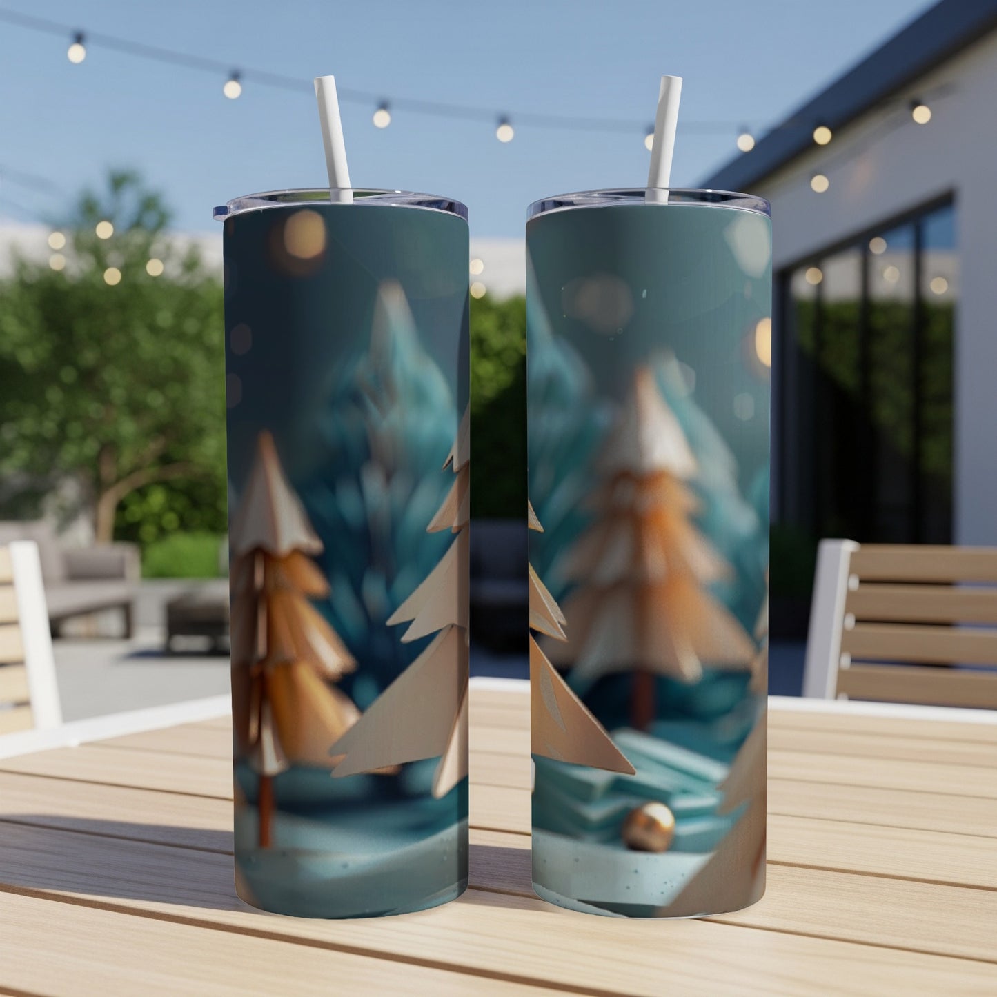 Two gold-toned trees on a teal background with bokeh lights, displayed on tumblers.