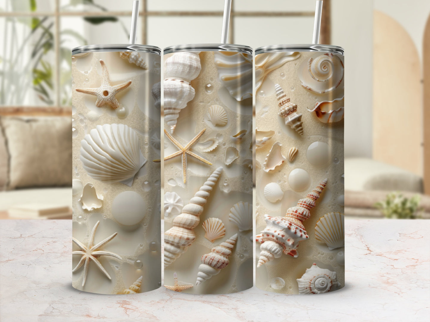 Beach seashell and starfish tumbler designs on a light, textured surface.