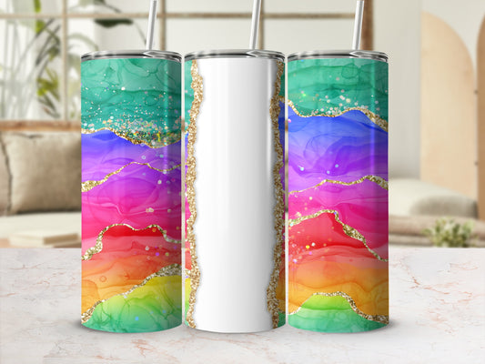 Rainbow alcohol ink tumbler with glitter accents and gold trim.