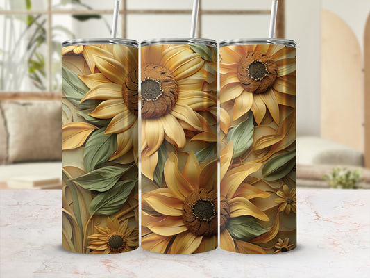 Three tumblers with sunflower and leaf patterns on a marble surface.