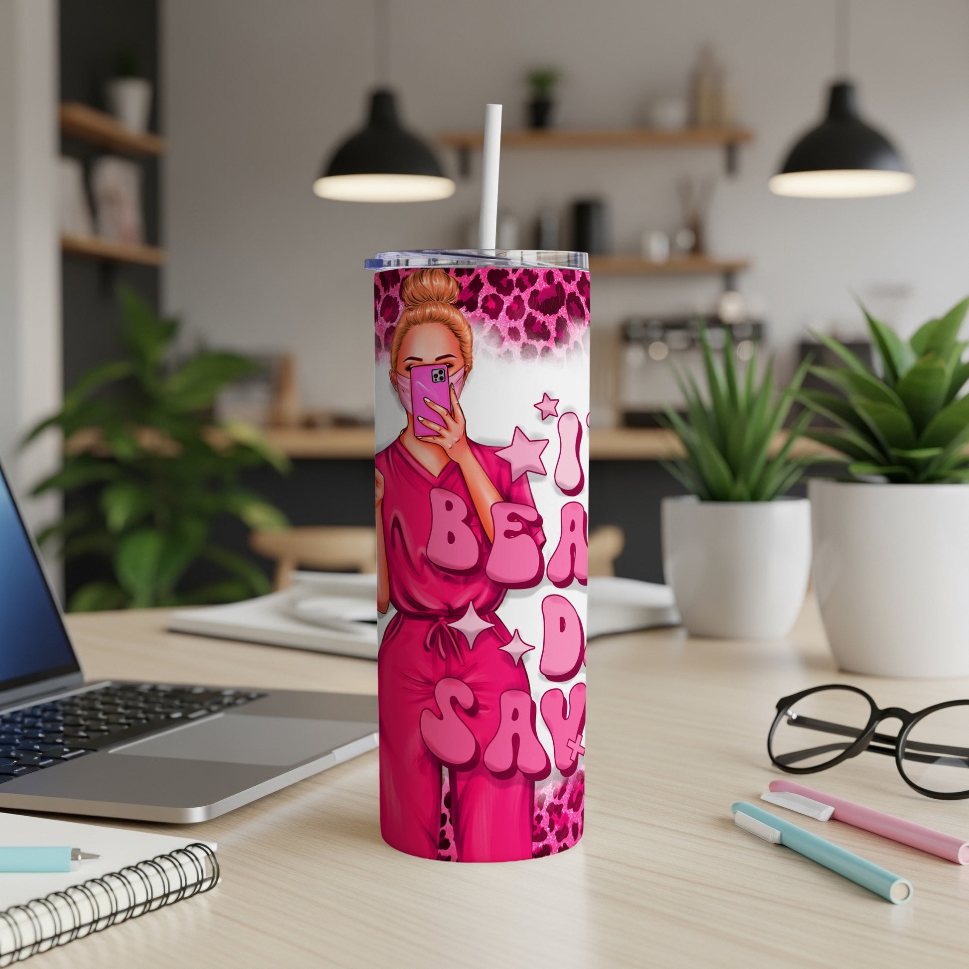 Pink tumbler with "I'm a badass" text and leopard print background.