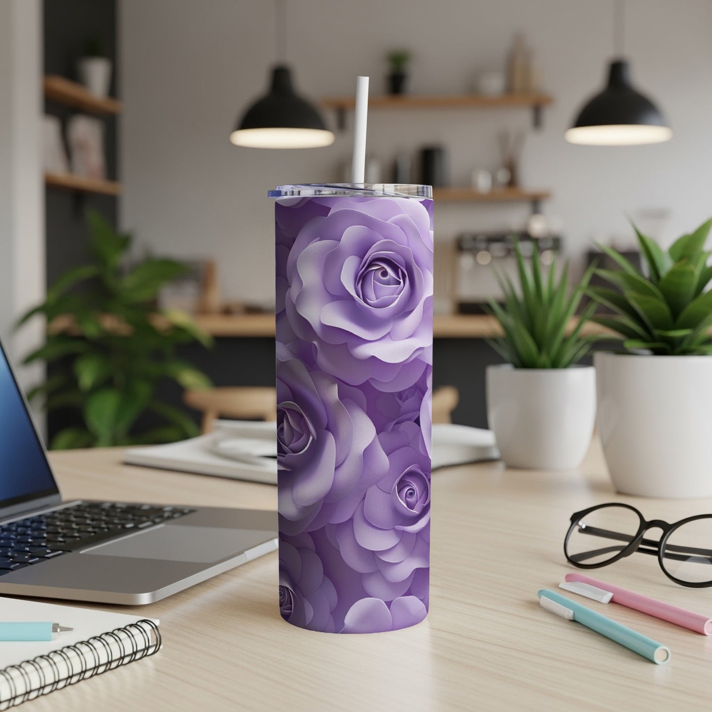 Purple floral pattern on a tall, slim tumbler with a straw.