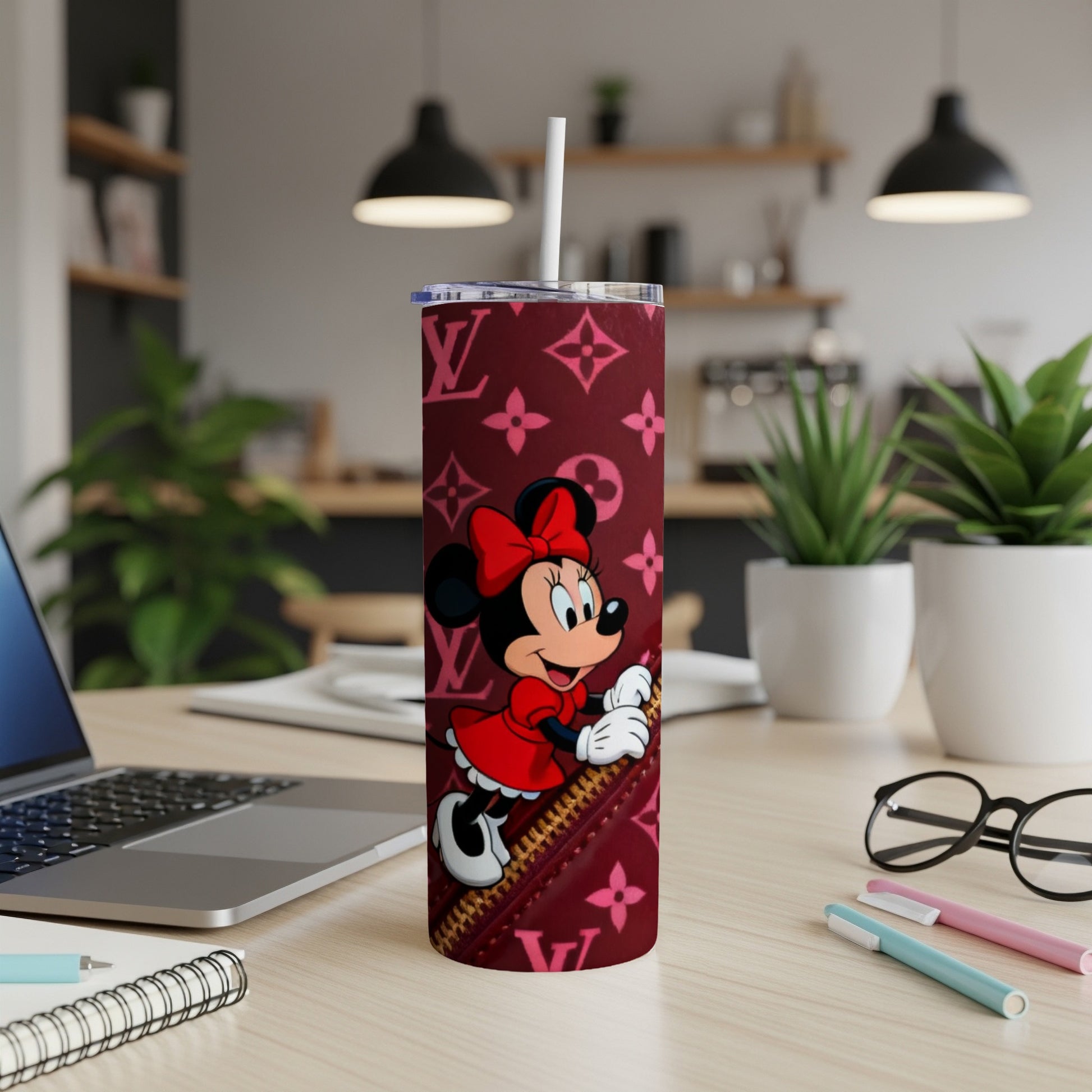 Minnie Mouse on a maroon tumbler with a LV pattern.
