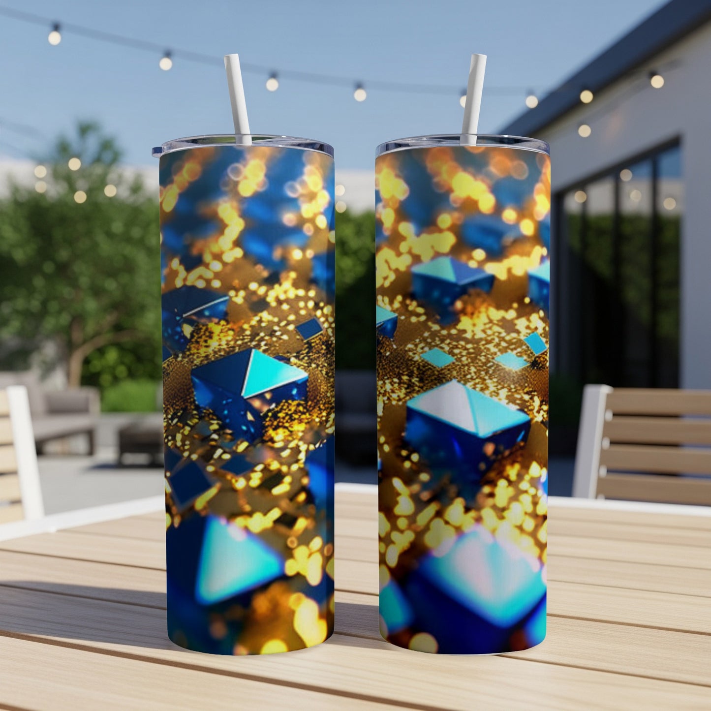 Two tall tumblers with a blue geometric pattern and bokeh lights.