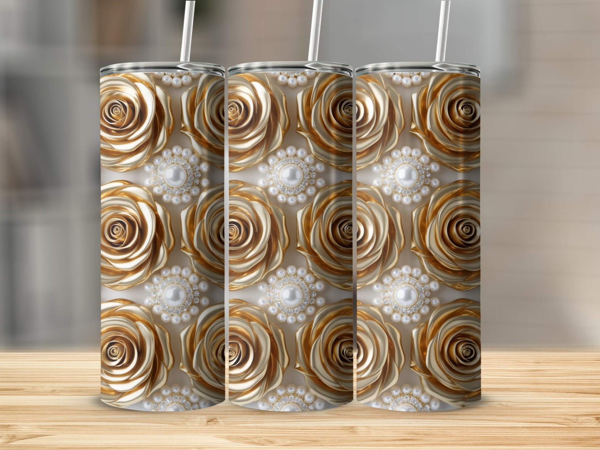 Gold rose and pearl pattern on three tumblers.