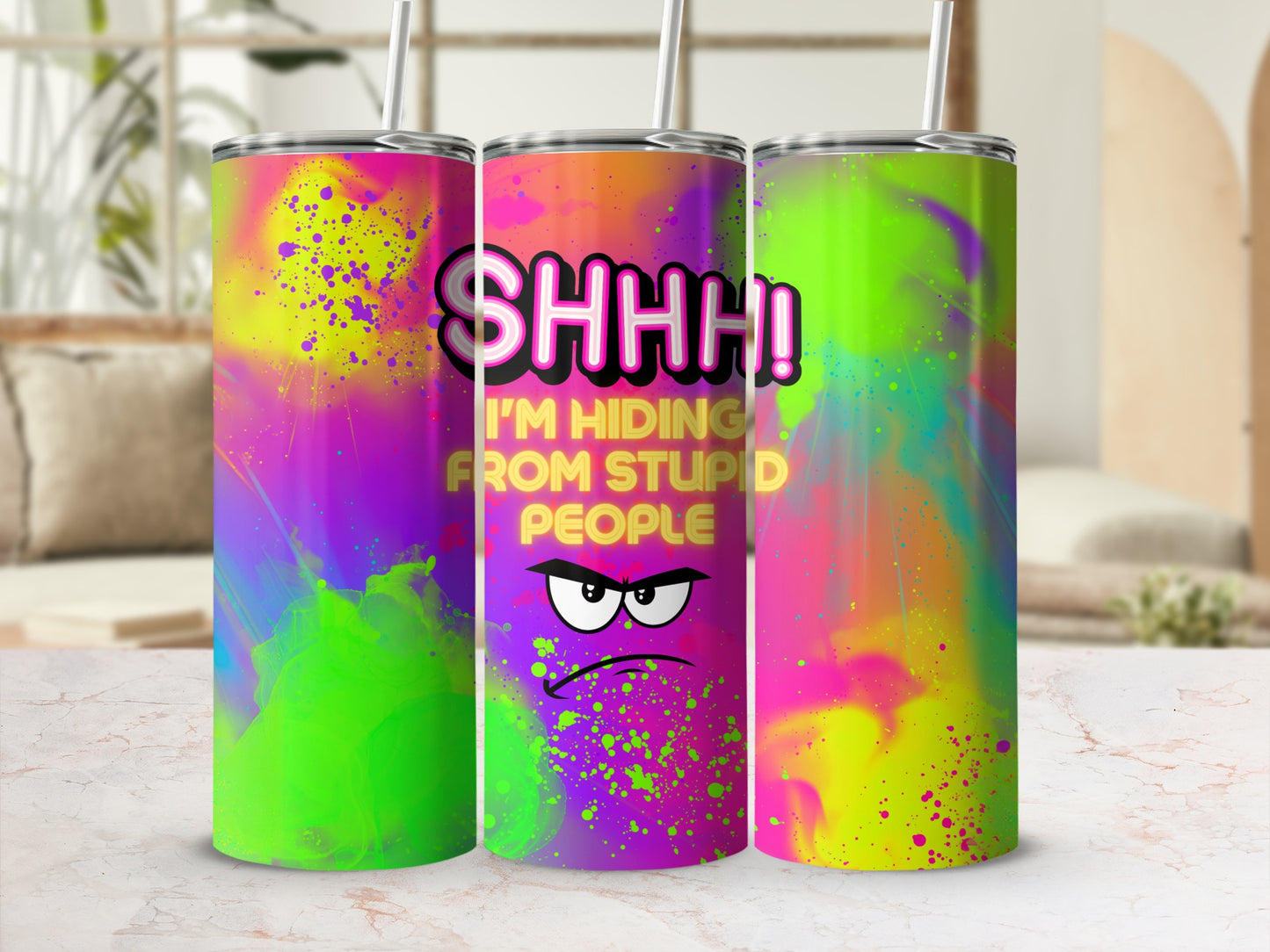 "SHHH! I'M HIDING FROM STUPID PEOPLE" graphic on a colorful, abstract design tumbler.