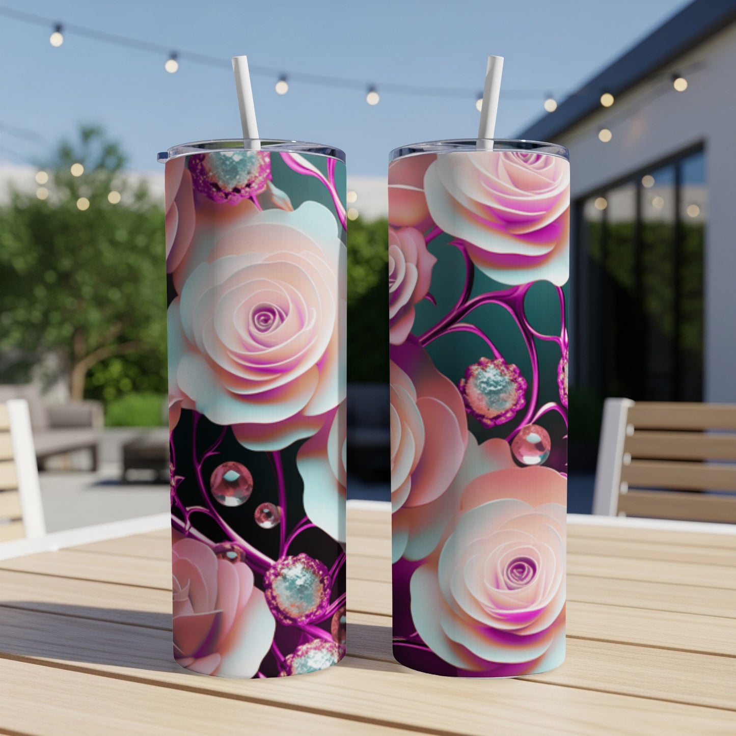 Two tall tumblers with pink and white roses, jewels, and straws.