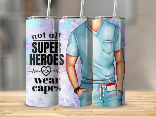 Blue scrub top tumbler with "Not all heroes wear capes" text and heart graphic.