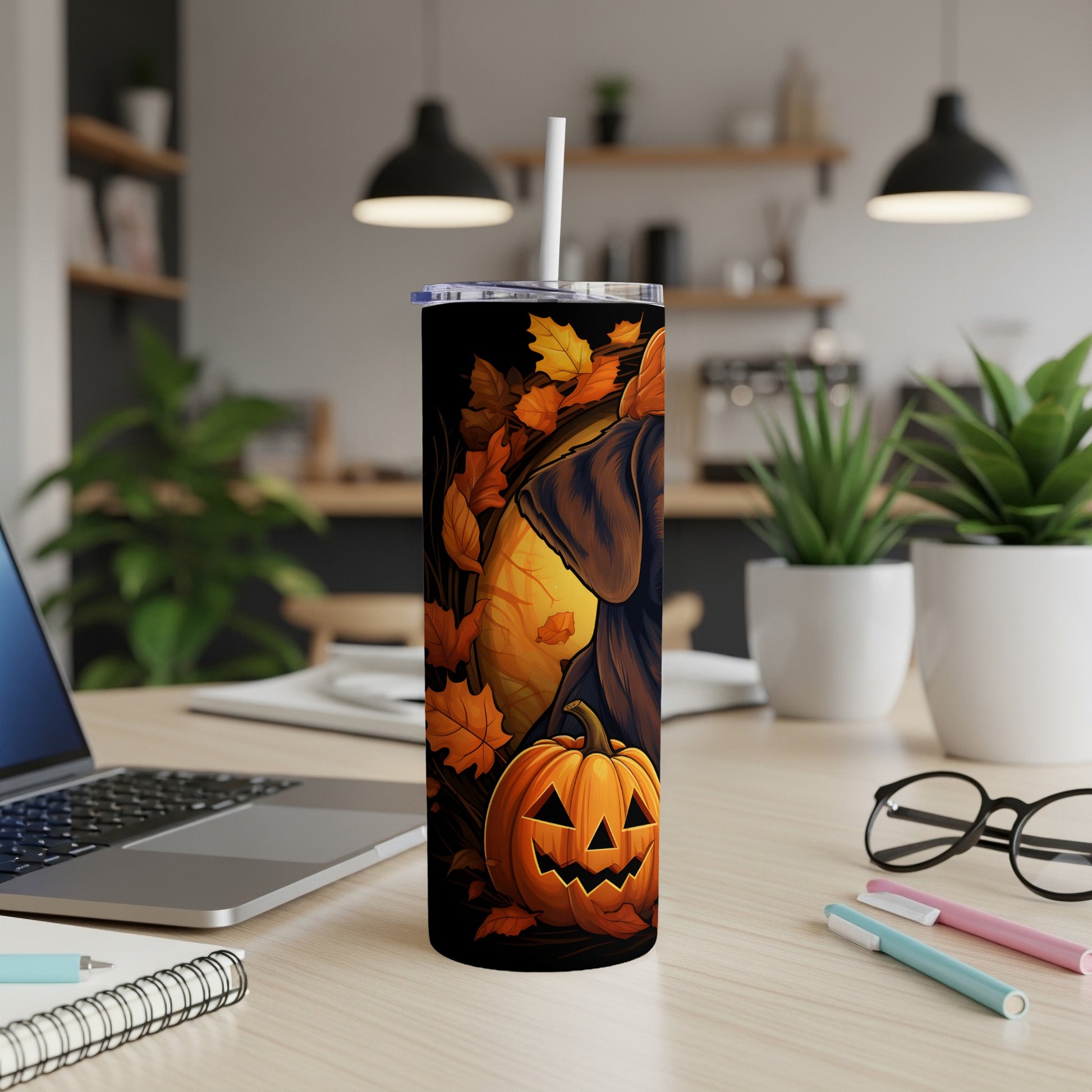 Black tumbler with jack-o'-lantern and fall leaves, featuring a dog's profile.