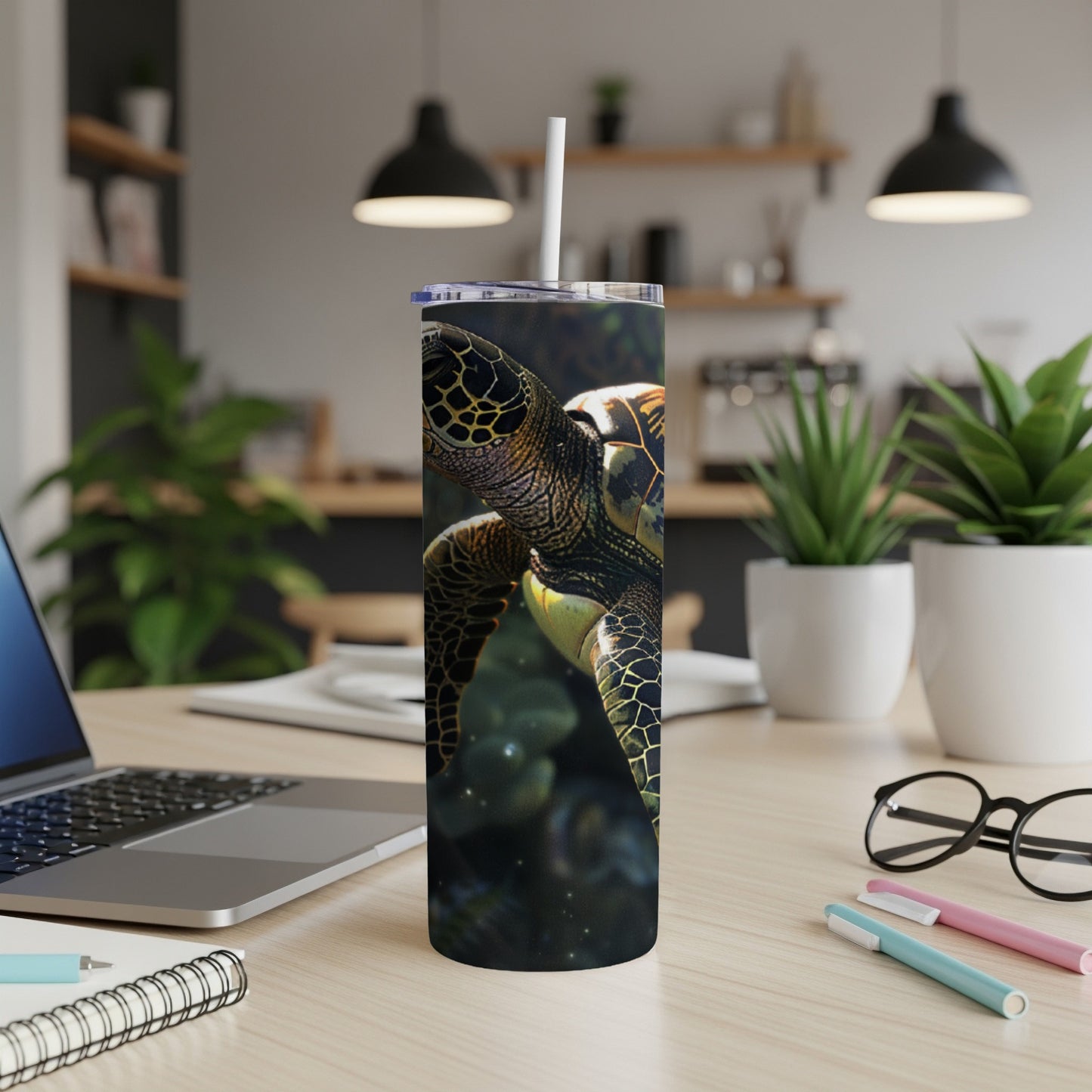 Green sea turtle design on a white tumbler with a straw.