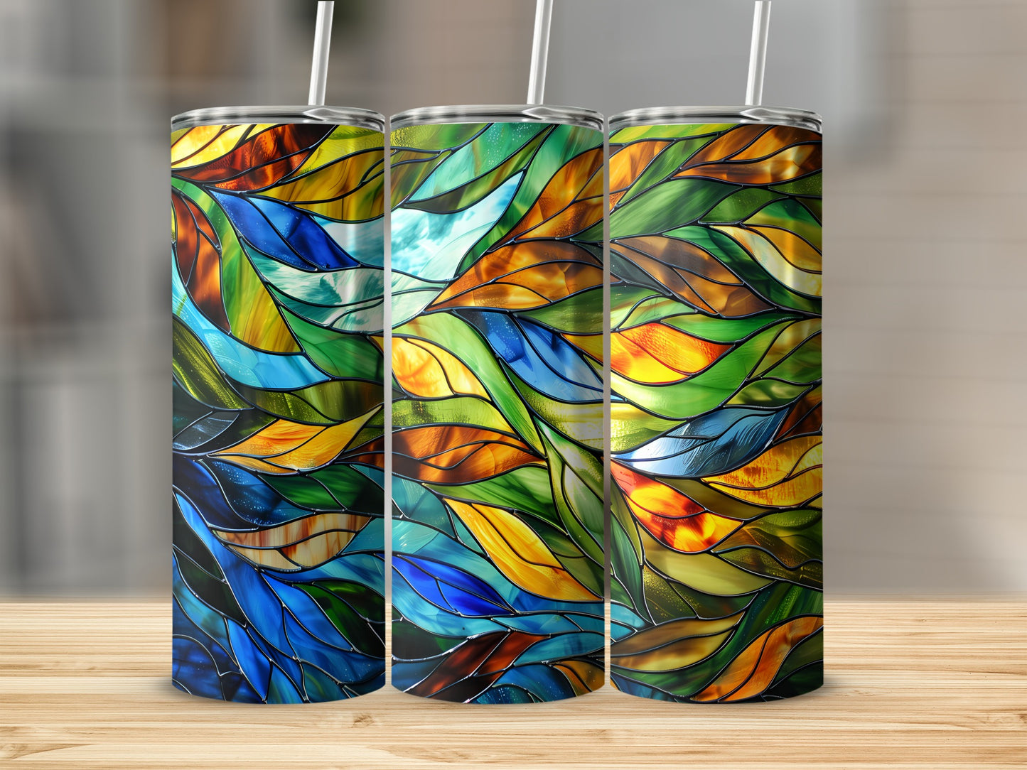Three tumblers with stained glass pattern in blue, green, and orange.
