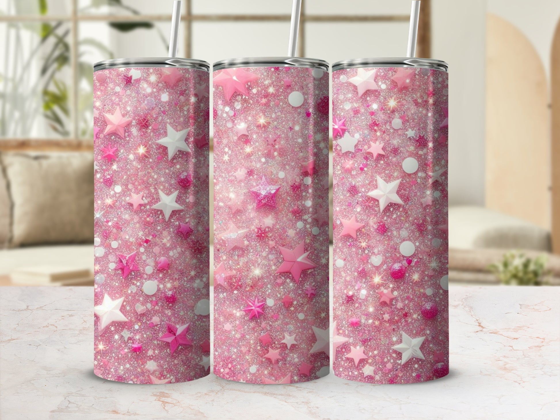 Pink glitter tumbler with stars on a marble surface.