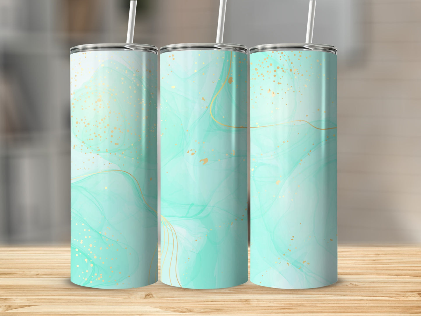 Three tumblers with mint green marbled design and gold glitter accents.