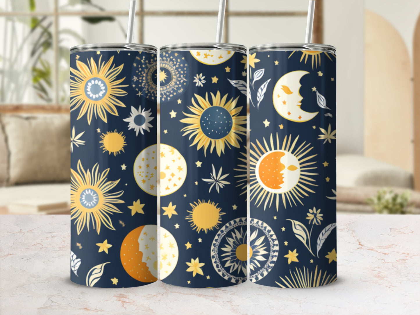 Three tumblers with a celestial navy blue pattern featuring suns, moons, and stars.