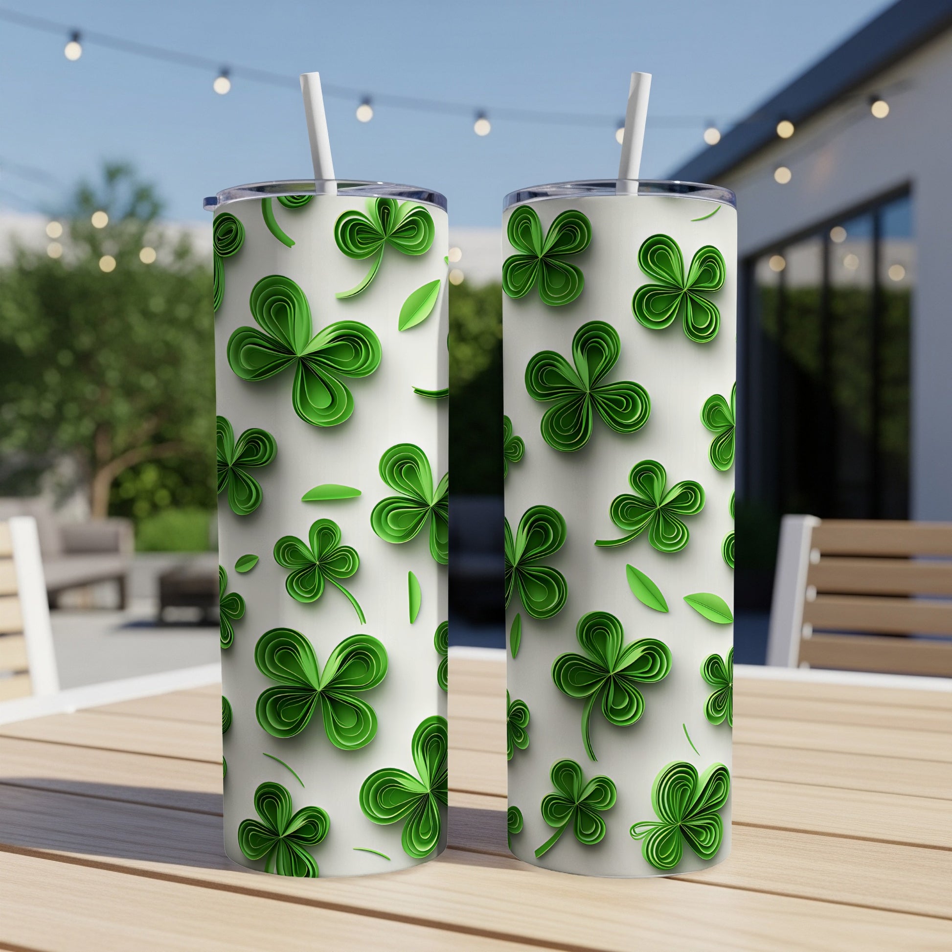 Two white tumblers with green shamrock and leaf pattern.