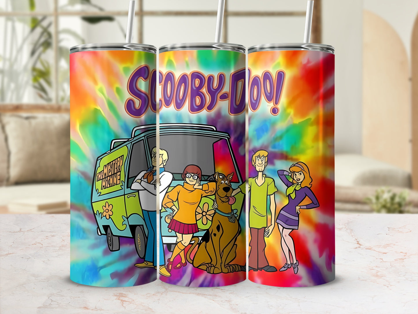 Scooby-Doo characters and the Mystery Machine on a tie-dye tumbler.