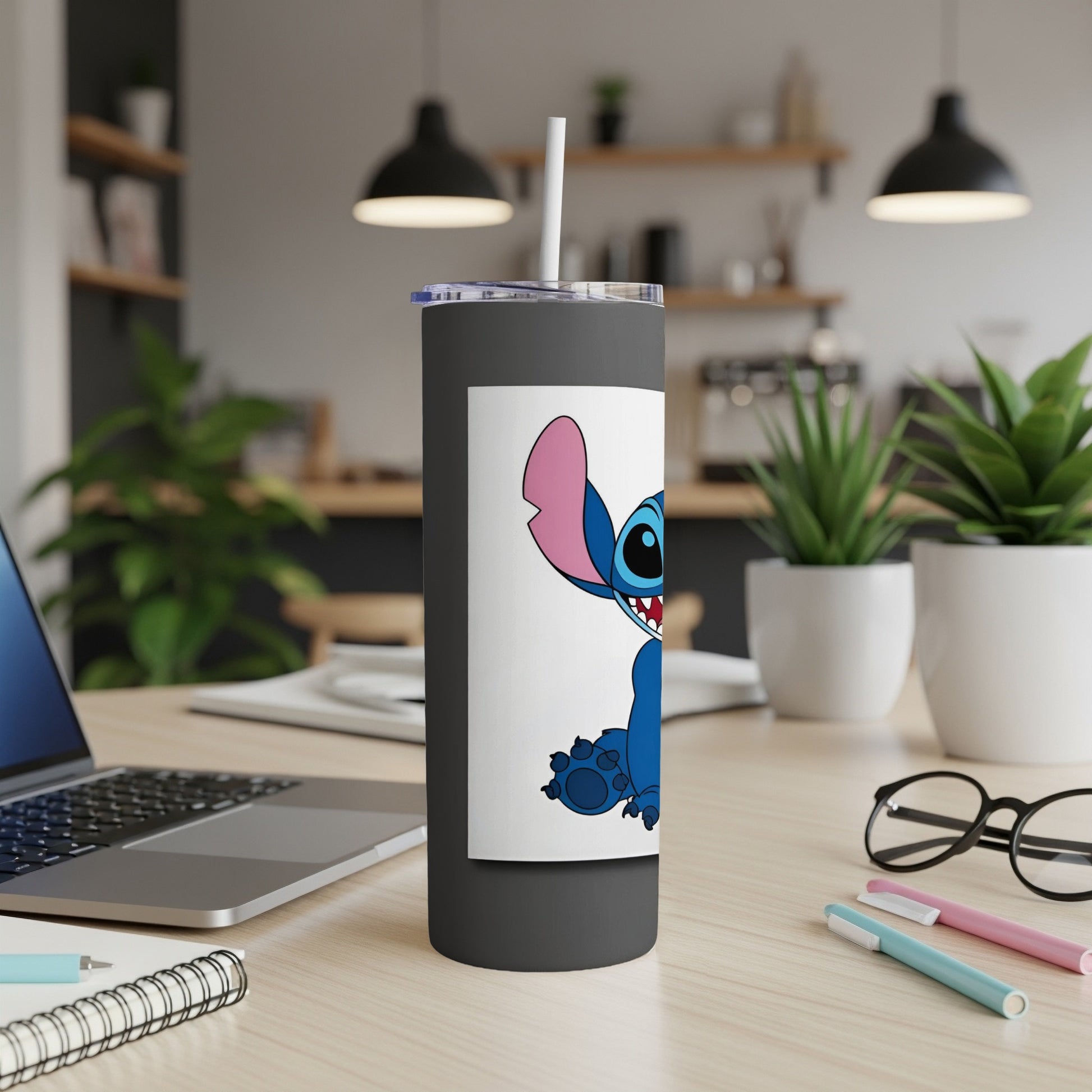 Black tumbler with cartoon Stitch character design and white straw.