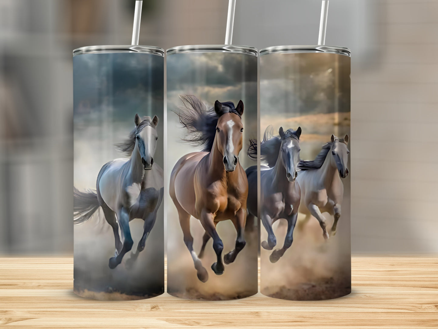 Three horses gallop through dust, a tumbler design.