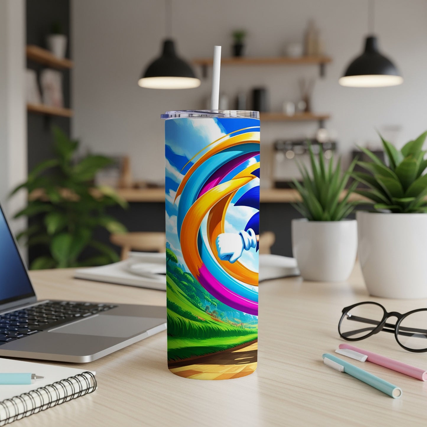 Colorful swirling graphic on a white insulated tumbler with a straw.